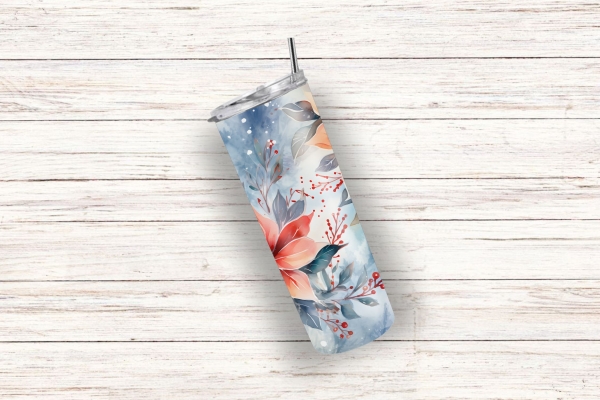 Ein Thermobecher mit einem eleganten Weihnachtsstern-Design in Rot- und Blautönen, auf einem weißen Holzuntergrund liegend, mit einem Trinkhalm und doppelwandiger Isolierung für Getränke unterwegs.
